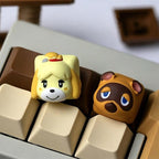 Tom Nook and Isabelle keycaps shown side by side on a keyboard | SIMPOCUBIC