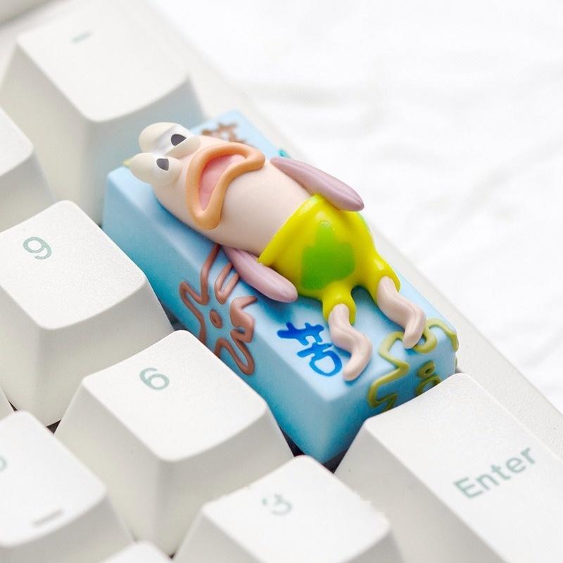 Bikini Bottom tired fish 2U keycap viewed at an angle on a white keyboard
