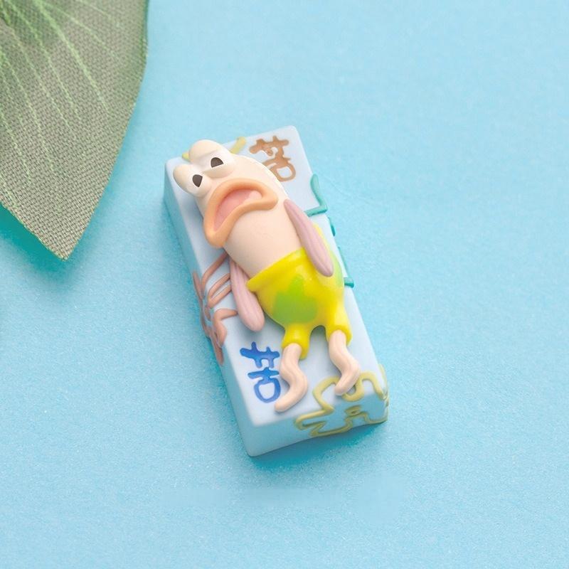 Tired fish 2U keycap on a blue background