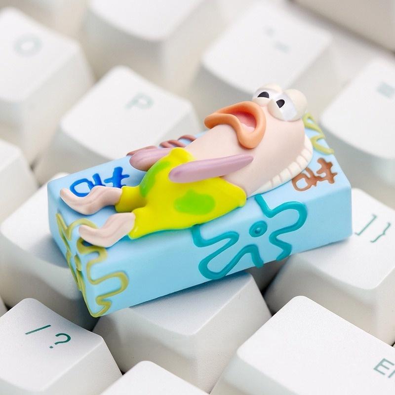 Side view of the tired fish 2U keycap on a white keyboard