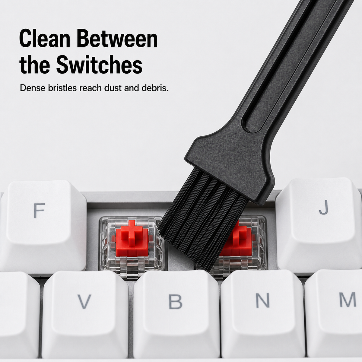 Keyboard cleaning brush removes dust between mechanical switches