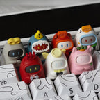 Seven Clockwork Momo character keycaps displayed together on a white keyboard