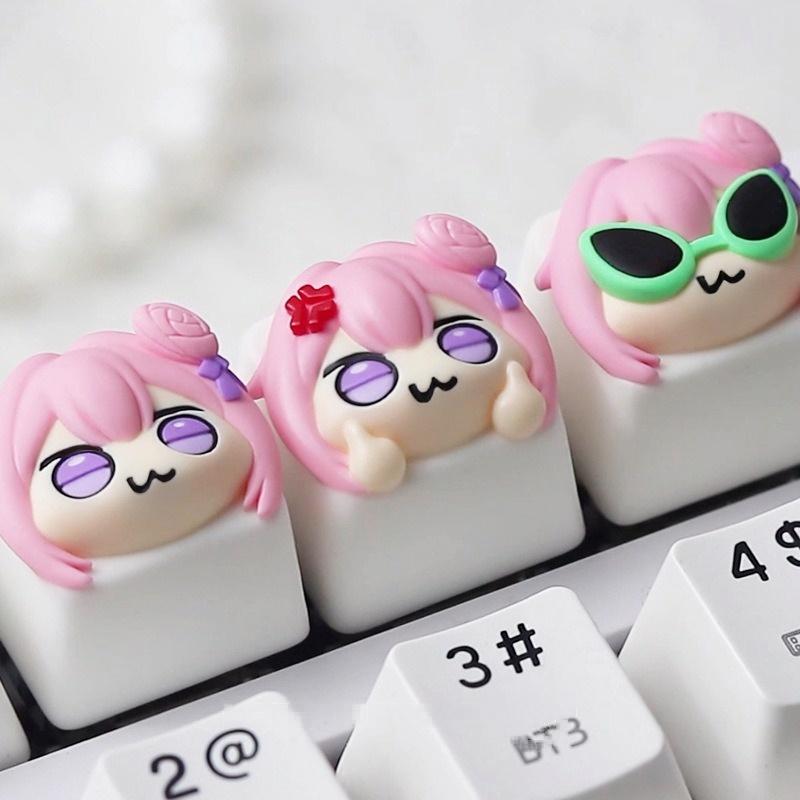 Three Doro expression keycaps fitted on a white keyboard | SIMPOCUBIC