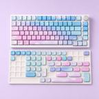 Dreamy MOA German QWERTZ keycaps with spare keys on an ivory display insert