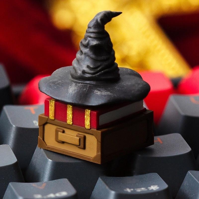 Sorting Hat keycap on a keyboard against red fabric | SIMPOCUBIC