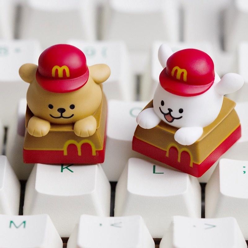 Two red-hat puppy keycaps shown on a white keyboard | SIMPOCUBIC