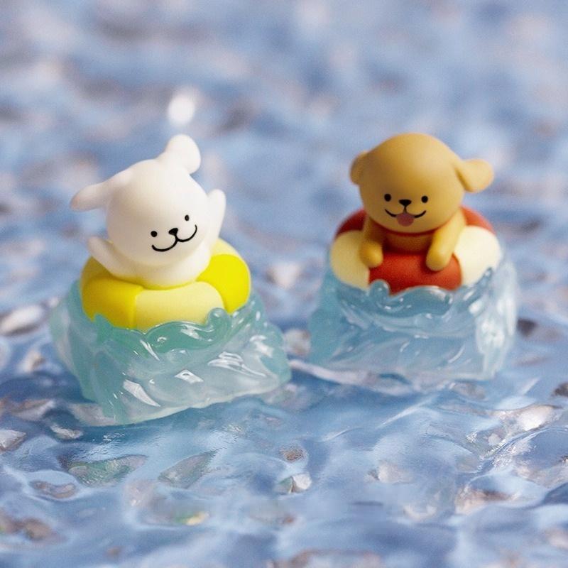 Two swim-ring puppy keycaps photographed in a water-themed scene | SIMPOCUBIC