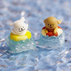 Two swim-ring puppy keycaps photographed in a water-themed scene | SIMPOCUBIC