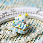 Blue Sanrio pudding character keycap photographed with pearl props | SIMPOCUBIC